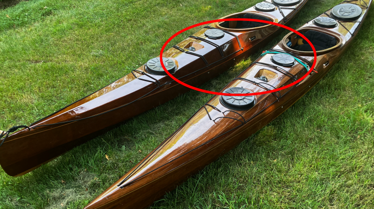 Whiskey hatch on two wooden kayaks